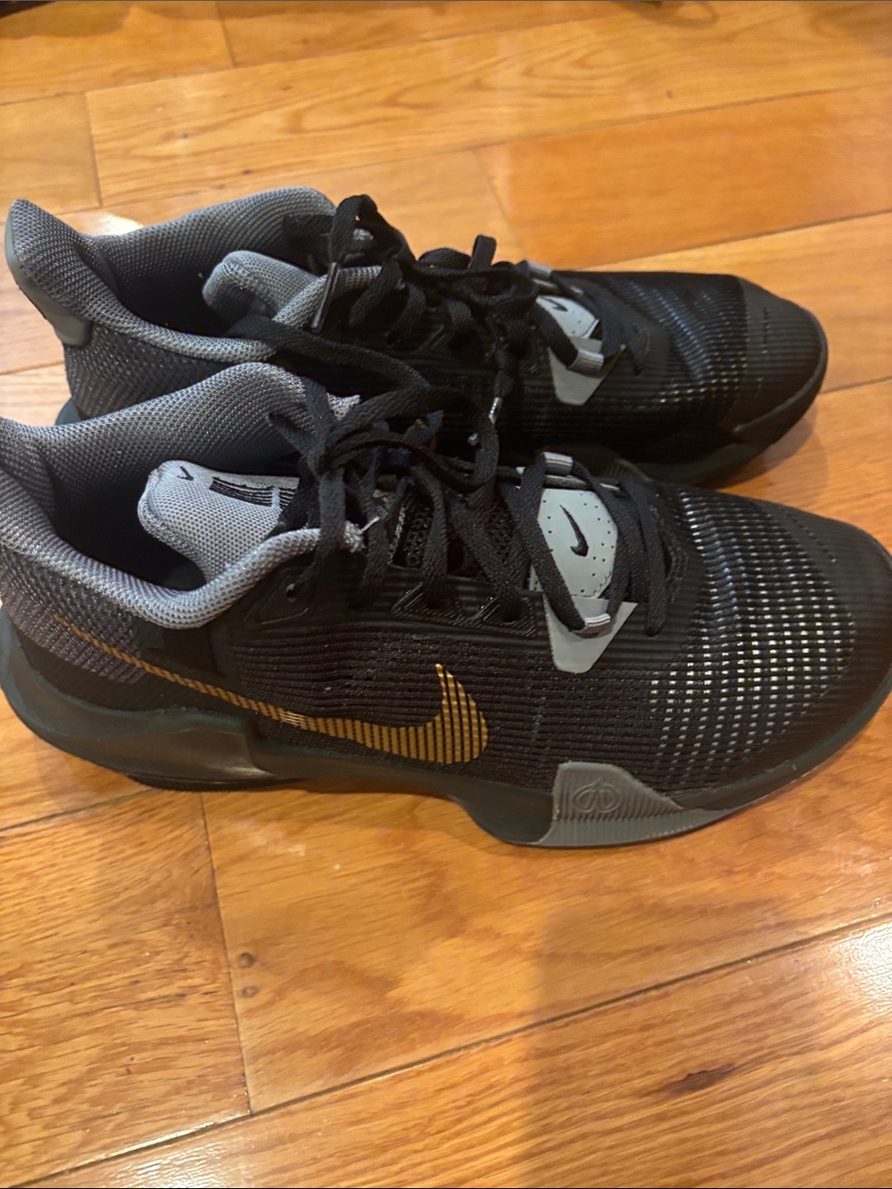Nike Men’s Black and Gray Athletic Shoes with Gold Swoosh Accent